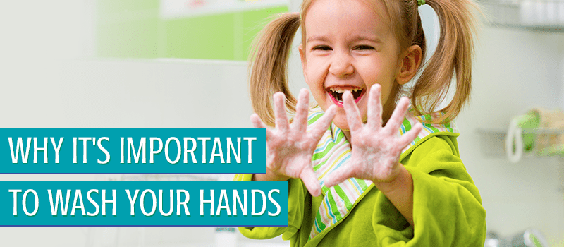 Little girl showing off her dirty hands and smiling