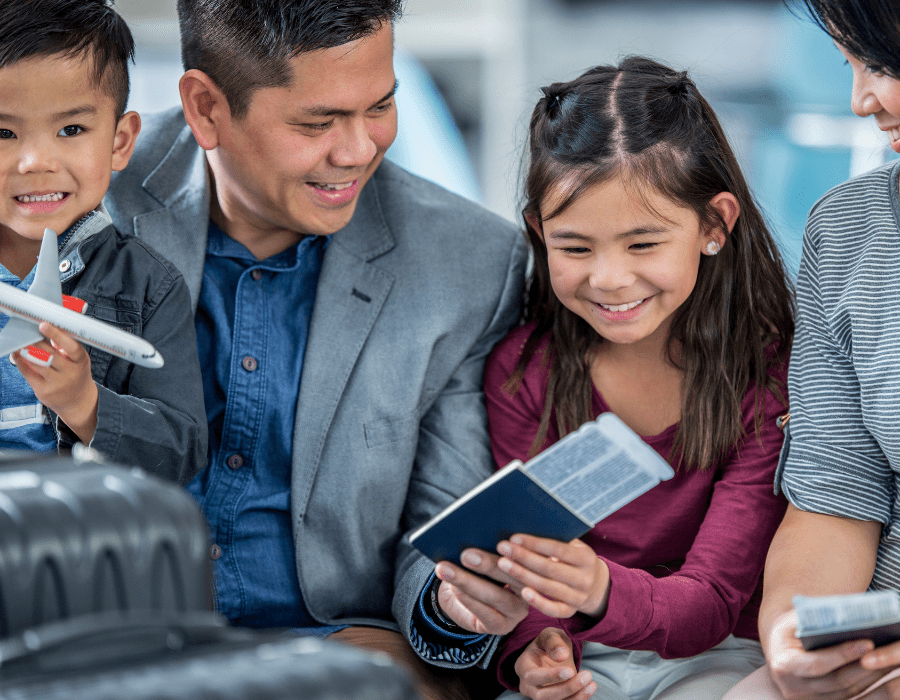 Family traveling with passport in airport