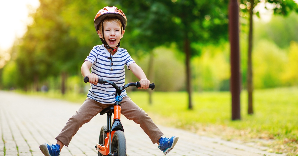 children on bike wearing helmet for outdoor spring safety